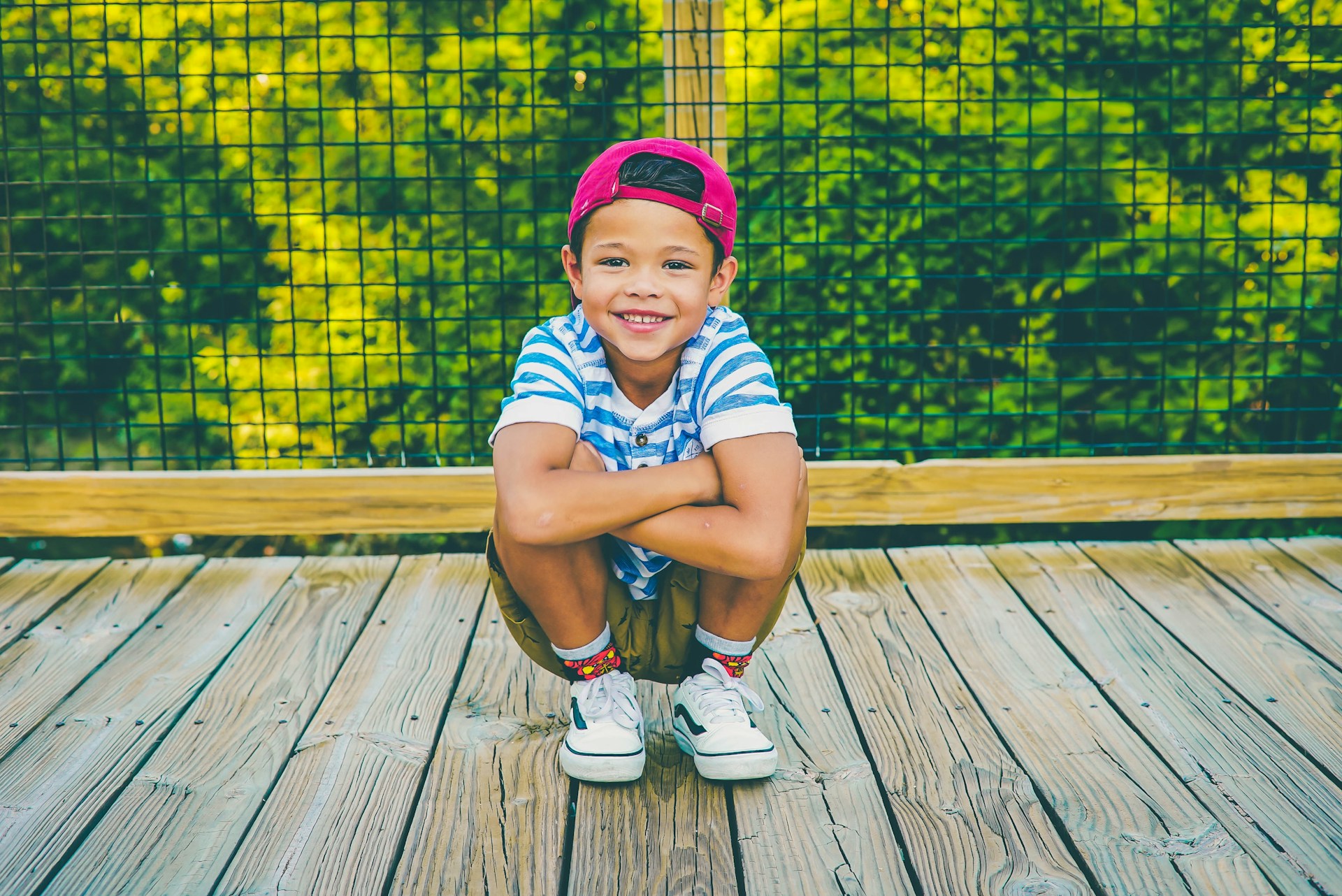 child on a deck with big smile - dental emergencies for kids