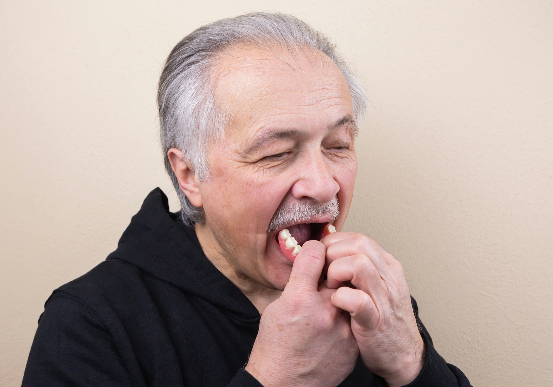 man removing dentures - which dentures are right for you